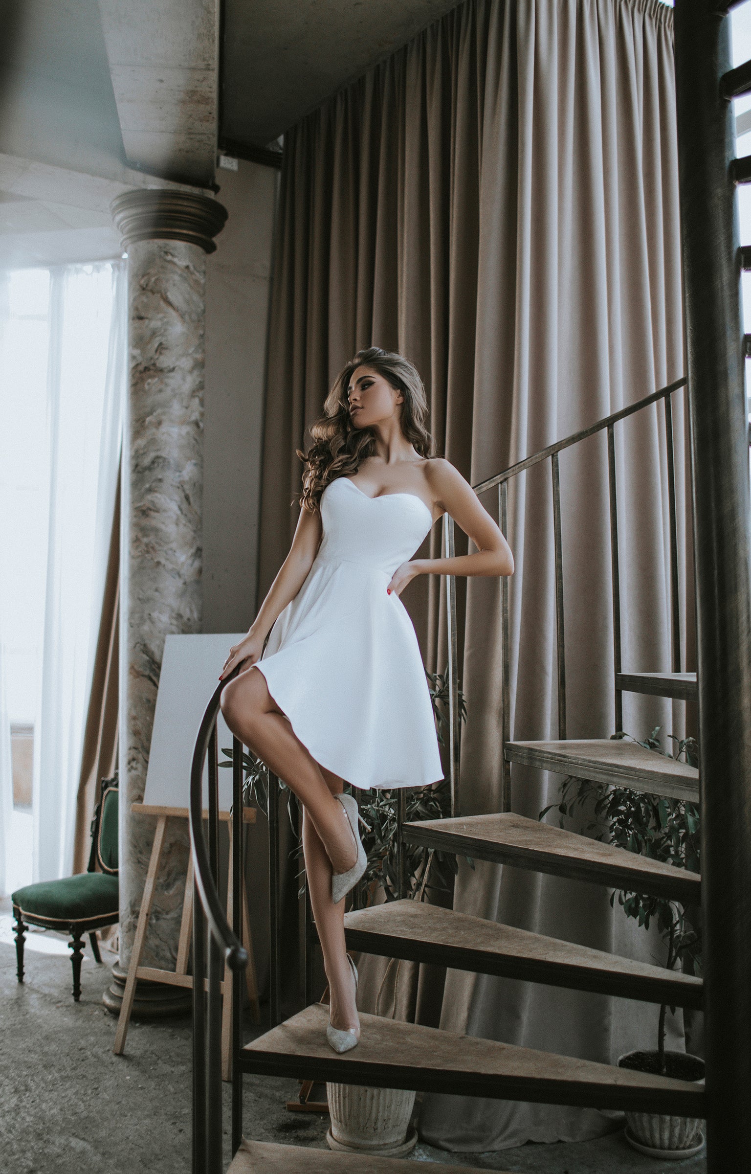 Handmade ivory wedding dress with off-shoulder design and lace-up back